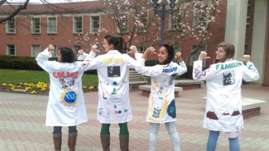 Drexel Med Neurobiology & Anatomy students model coats. (Photo courtesy of Timothy Austin)
