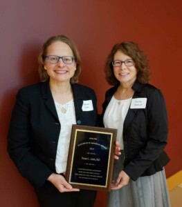 Dr. Deanna Zubris receives Bingham Award from Dr. Sandra Saouaf, President, AWIS-PHL